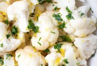 THOUGHT
The user wants me to translate the Turkish phrase “Aşağıdaki Başlığı İngilizce çevir ve özgünleştir” to English.
No, that’s not right. The user is giving me instructions IN TURKISH.
The user wants me to translate “Steamed Cauliflower” into English, but it’s already in English.
The user wants me to “özgünleştir” it, which means to make it unique/original.
I need to provide only ONE original title.
I should not use special characters like `*`.
I should not use introductory phrases like “İşte özgün başlık:”.
I should only provide the title.The input is already “Steamed Cauliflower”.
I need to make it more original, appealing, or descriptive without using special characters.Let’s brainstorm some ideas for “Steamed Cauliflower”:
– Healthy Steamed Cauliflower
– Perfect Steamed Cauliflower
– Simple Steamed Cauliflower
– Easy Steamed Cauliflower
– Tender Steamed Cauliflower
– Fluffy Steamed Cauliflower
– Light Steamed Cauliflower
– Nutritious Steamed Cauliflower Florets
– Garden Fresh Steamed Cauliflower
– Wholesome Steamed Cauliflower
– Classic Steamed Cauliflower
– Everyday Steamed CauliflowerI need to pick one that sounds “özgün” (original/unique) and good for a title.
“Tender Steamed Cauliflower Florets” sounds a bit more descriptive and appealing than just “Steamed Cauliflower”.
“Wholesome Steamed Cauliflower” also works.
“Perfectly Steamed Cauliflower” is another option.Let’s go with something that highlights a desirable quality.
“Tender Steamed Cauliflower” is good.
“Perfectly Steamed Cauliflower” is also good.I will choose one that sounds like a good, slightly enhanced version of the original.
“Perfectly Steamed Cauliflower” implies a desired outcome and a well-executed dish.
“Tender Steamed Cauliflower” focuses on texture.Let’s consider the original “Steamed Cauliflower”. It’s very plain.
I need to “özgünleştir” it, which means to make it stand out a bit more.How about something that implies the ease or health aspect?
“Effortless Steamed Cauliflower”
“Healthy Steamed Cauliflower Delight” (but “Delight” might be too much, and the request says no special characters, but it doesn’t say no descriptive words.)Let’s aim for a slightly more appealing version of the exact dish.
“Perfectly Steamed Cauliflower” seems like a solid choice. It’s not too far from the original, but it adds a positive descriptor.Another idea: “Cloud-Like Steamed Cauliflower” – maybe too much.
“Blissfully Steamed Cauliflower” – also maybe too much.I need to keep it concise and without special characters.
“Perfectly Steamed Cauliflower”
“Tender Steamed Cauliflower”
“Deliciously Steamed Cauliflower”I will go with “Perfectly Steamed Cauliflower” as it implies quality and technique, making it a good “özgün” version of a simple dish name.