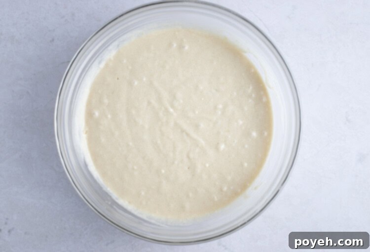 Coffee cake batter in large glass bowl