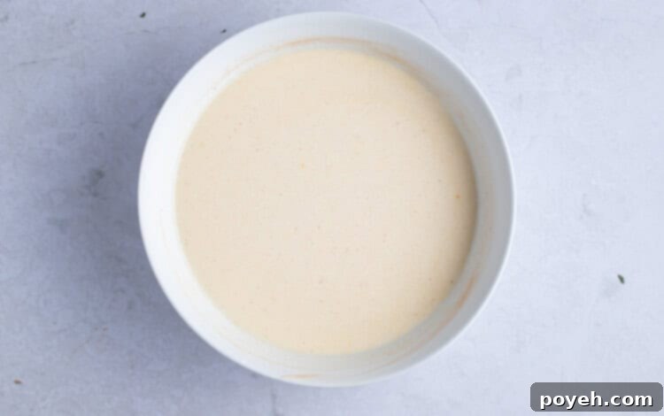 Glaze for vegan coffee cake in large white bowl