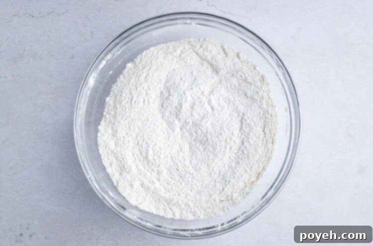 Dry ingredients for vegan coffee cake in large glass bowl