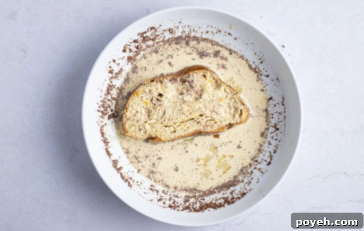 Bread in egg wash for air fryer french toast