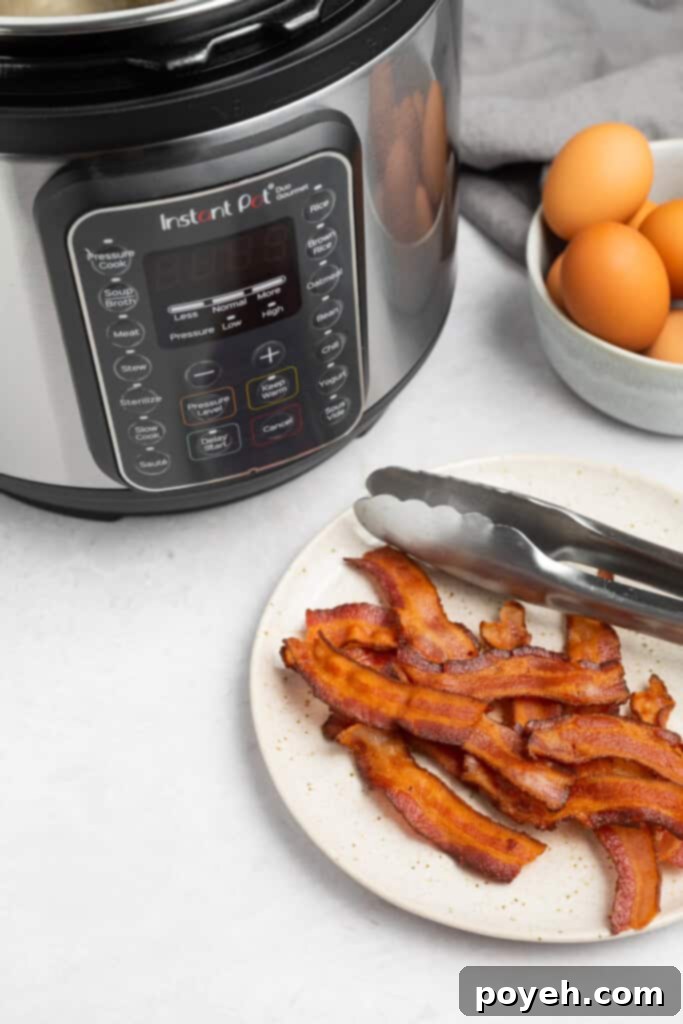 Instant Pot Bacon Perfection 3 a plate of bacon in front of an instant pot and a bowl of eggs