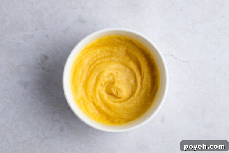 Keto English muffin batter in ramekin, smooth and ready to microwave.