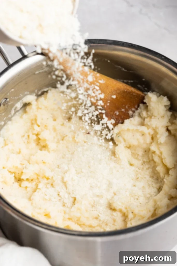 Dehydrated potatoes being poured into a pot of mashed potatoes