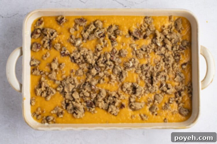 Uncooked sweet potato pudding in baking dish