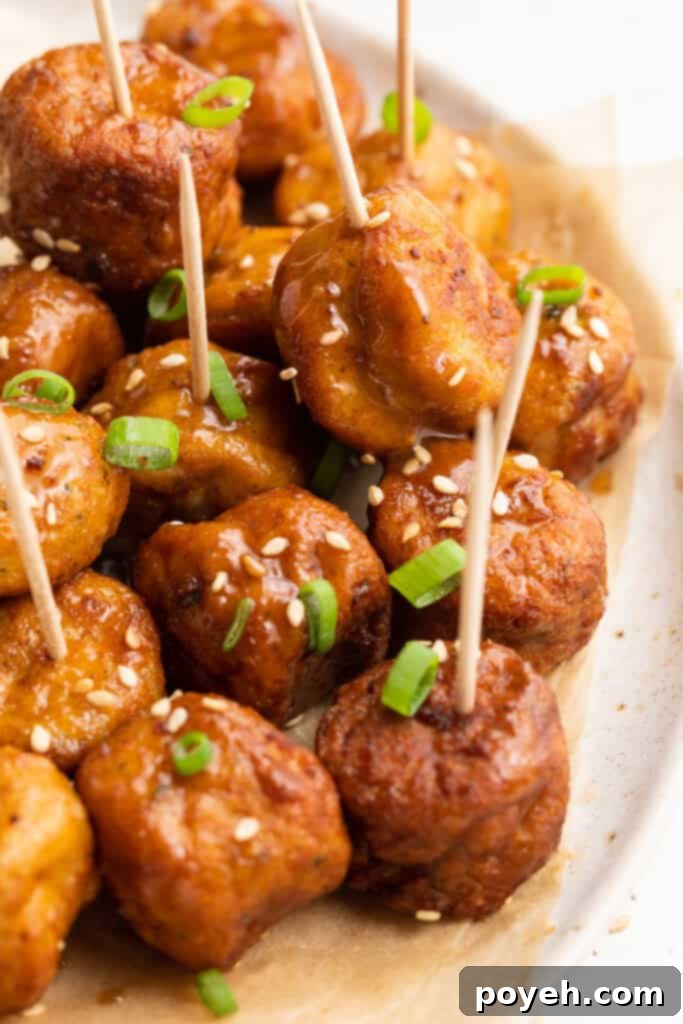 Perfectly air-fried frozen meatballs on a plate with toothpicks, ready to be served as an appetizer.