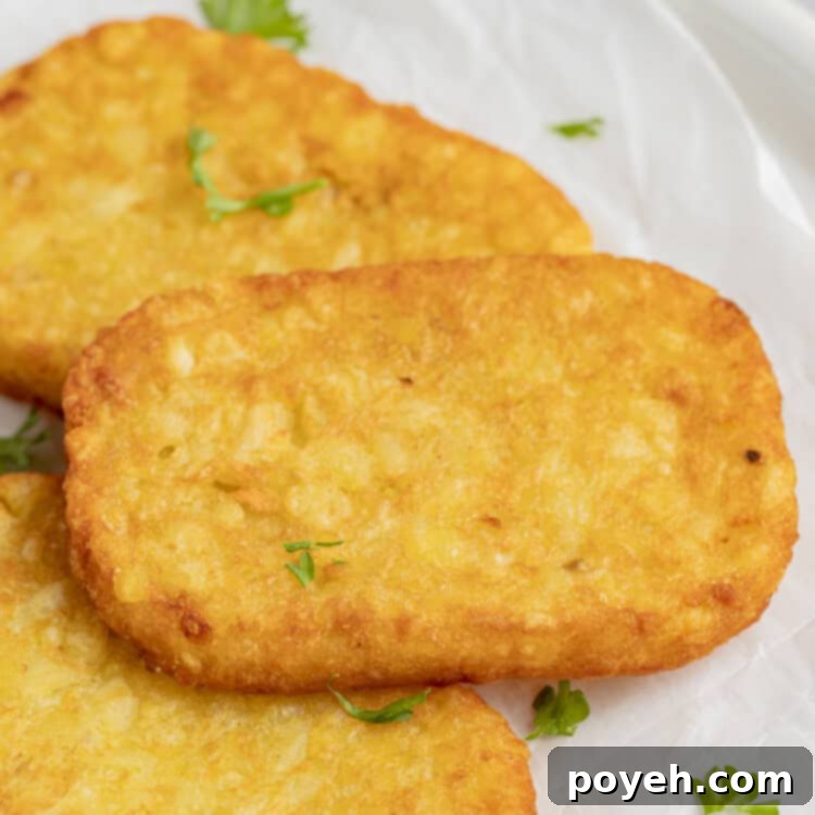 Hashbrowns cooked in the air fryer and served on a plate, ready to be enjoyed