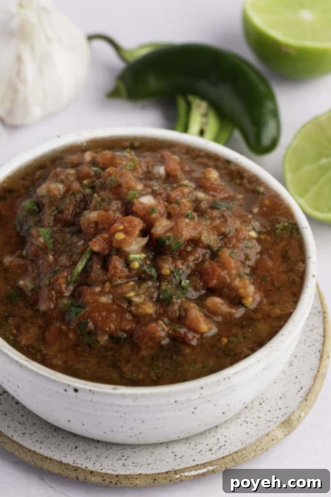 Freshly made chunky keto salsa in a pristine white bowl, garnished with cilantro, ready to be served