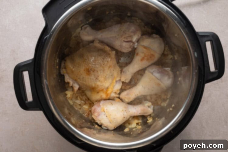 Browning chicken pieces in the Instant Pot for Chicken Paprikash recipe.