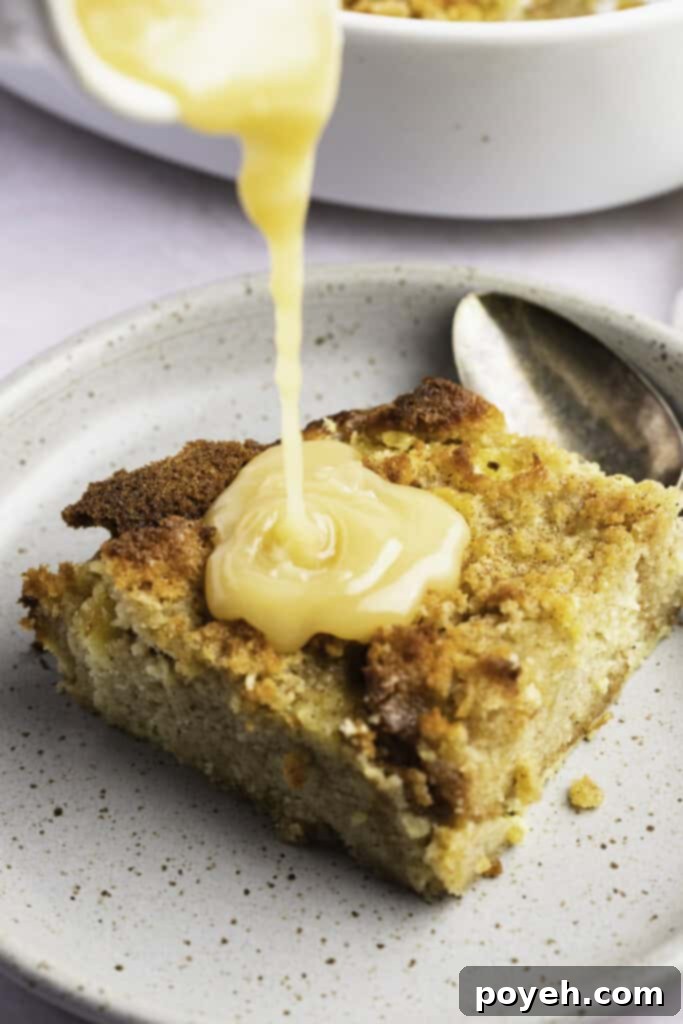 Decadent Keto Bread Pudding 3 Vanilla sauce poured over the top of a square of keto bread pudding