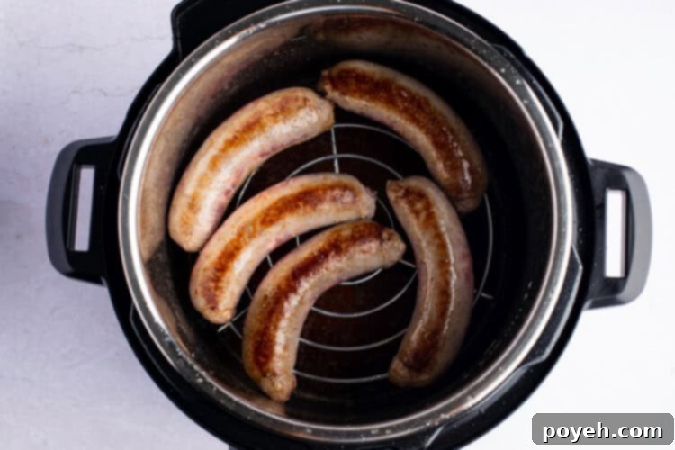 Overhead photo of bratwurst on trivet in Instant Pot.
