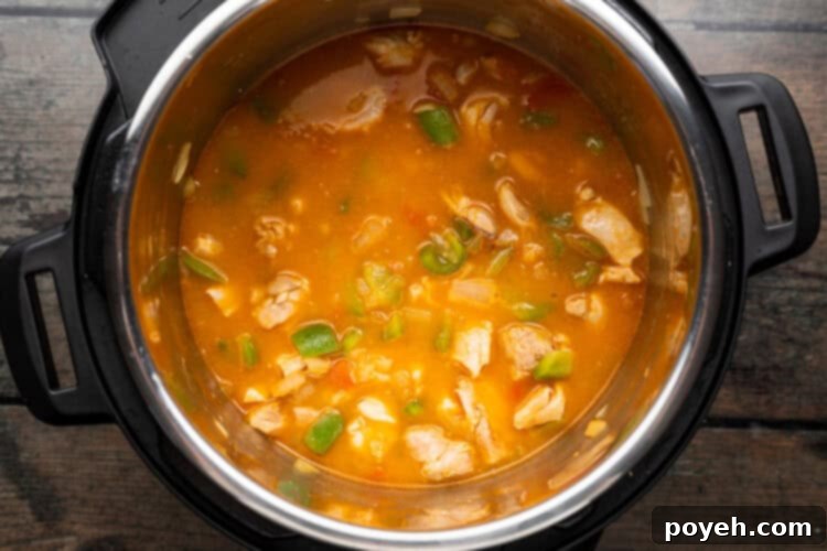 Overhead view of paella ingredients in an Instant Pot.