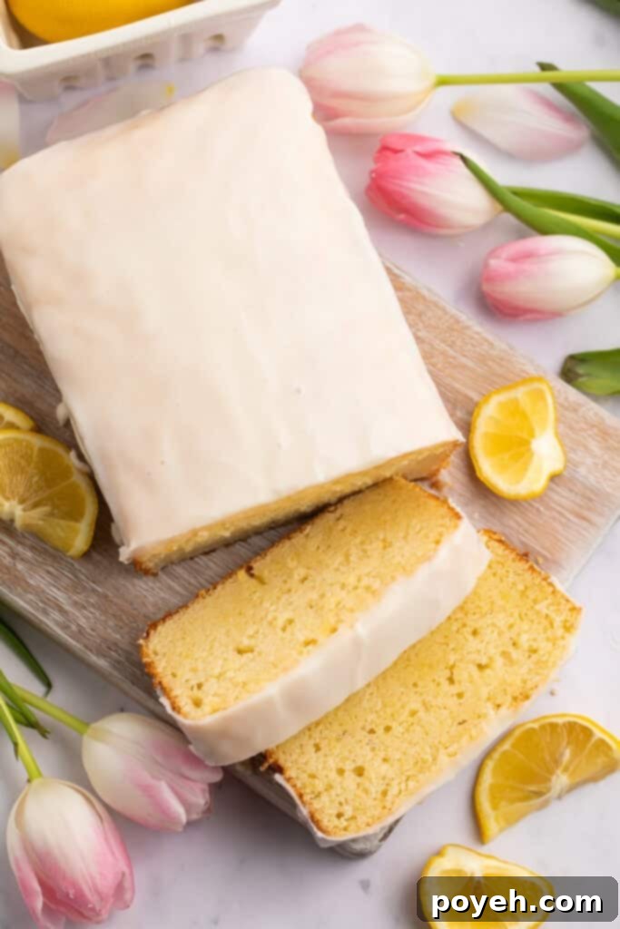 Overhead view of a perfectly baked gluten-free lemon cake, with two delicious slices resting alongside the main loaf, ready to be enjoyed.