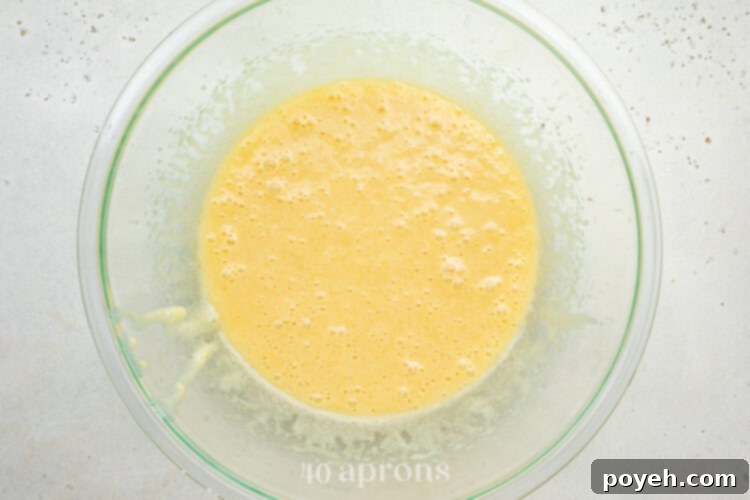 Wet ingredients mixed with eggs to form the base of the dairy free brownies.