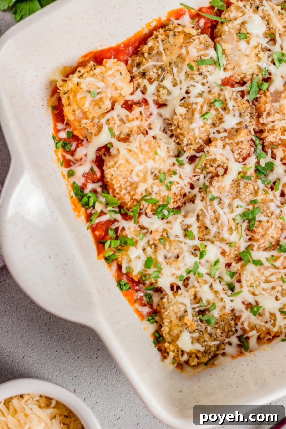 Top down view of a casserole dish of shrimp parmesan.