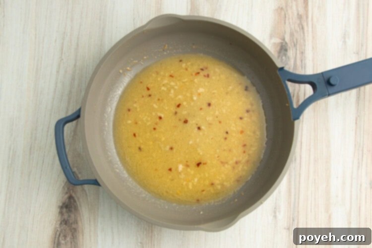 Lemony Garlic Shrimp with Rice 10 Shrimp scampi sauce in skillet.