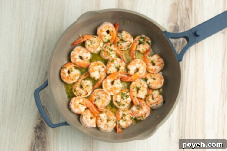 Lemony Garlic Shrimp with Rice 11 Shrimp scampi in skillet.