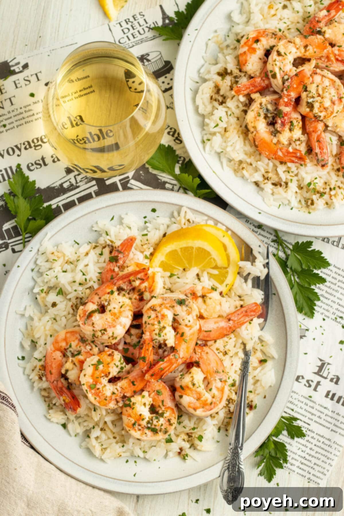 Lemony Garlic Shrimp with Rice 3 Overhead view of shrimp scampi on a plate of white rice.
