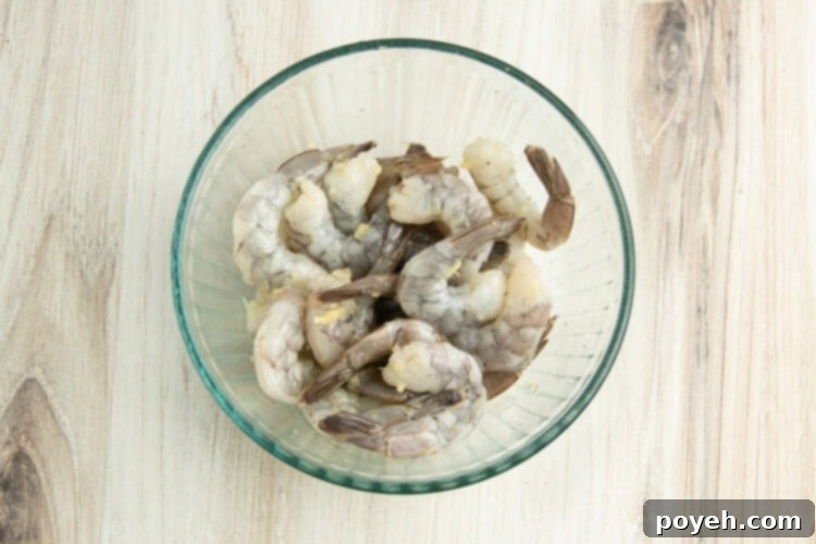 Lemony Garlic Shrimp with Rice 6 Shrimp in medium glass mixing bowl.