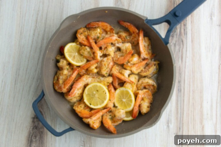 Finished Shrimp Francese dish in a skillet, ready for serving.