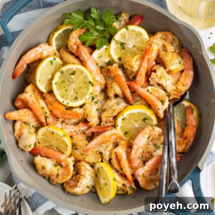 Overhead view of shrimp francese in a large skillet, ready to be served.