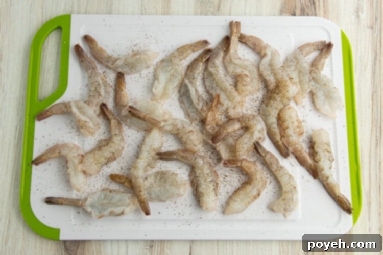 Shrimp seasoned with salt and freshly ground black pepper.