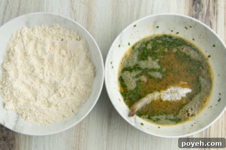 Shrimp coated in the flavorful batter, ready to be pan-fried.