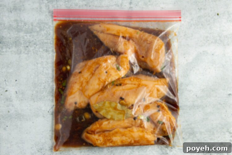 Chicken breasts in a Ziploc bag with adobo marinade.