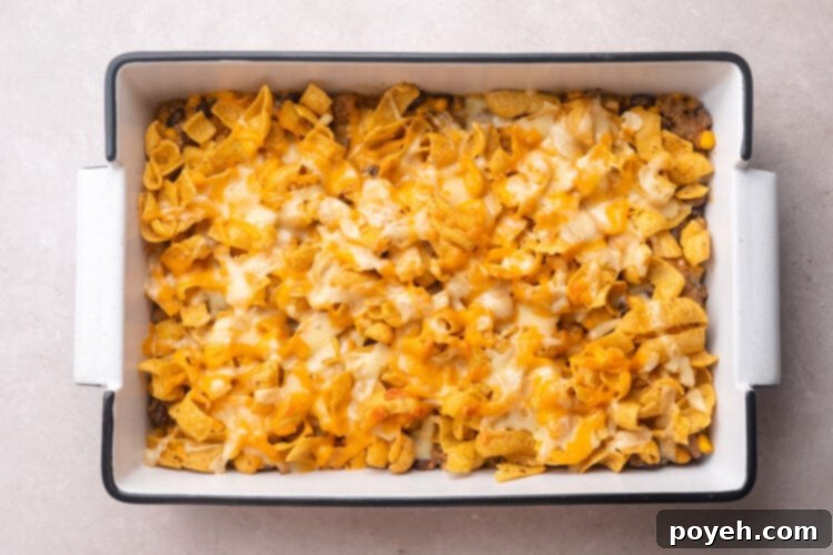 Baked walking taco casserole in a 9x13 baking dish.