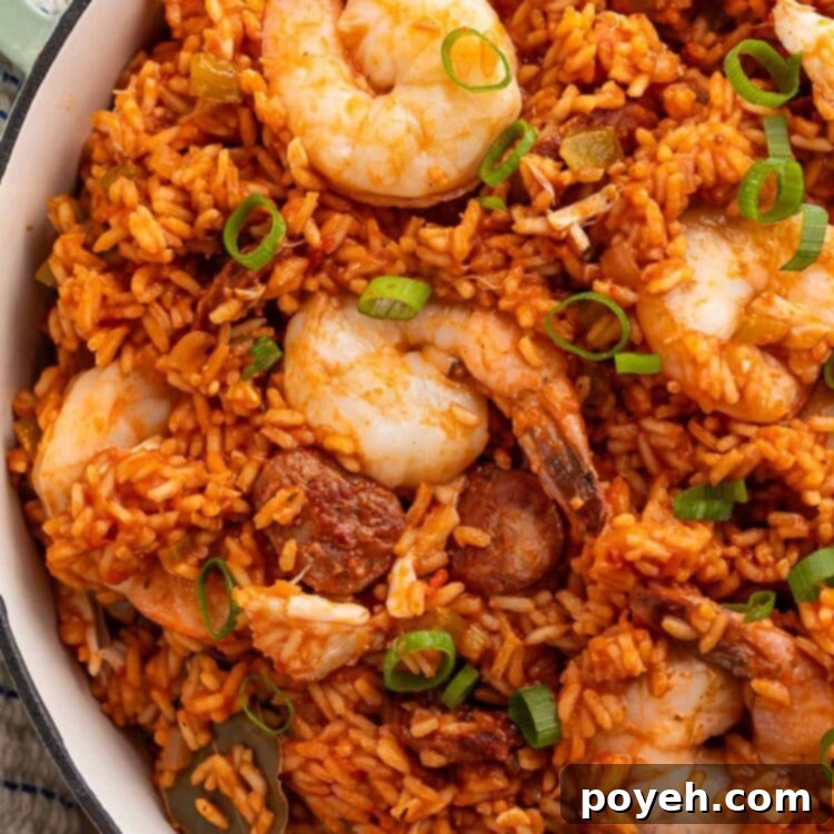 Cajun Seafood Fiesta 6 A large Dutch oven holding rich, vibrant seafood jambalaya made with luscious shrimp and tender rice.