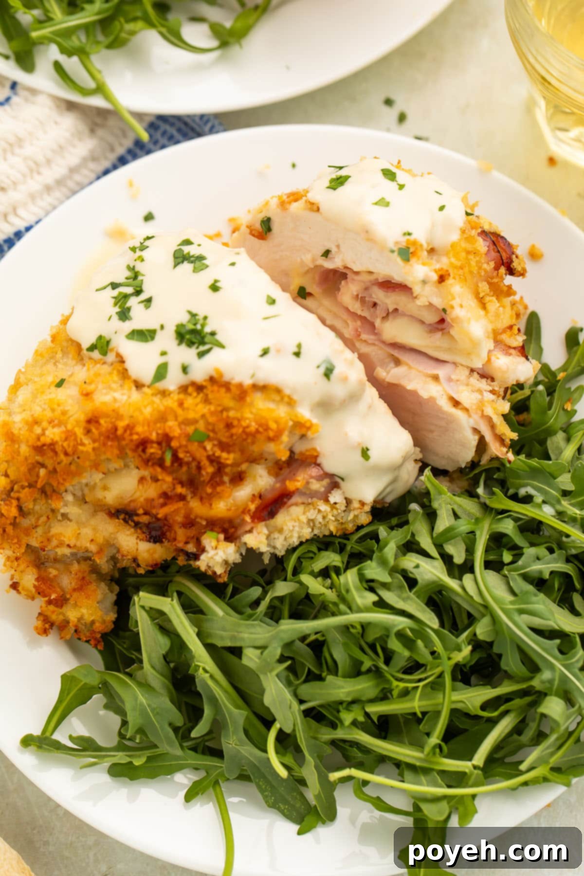 Air fryer chicken cordon bleu plated with a green salad.