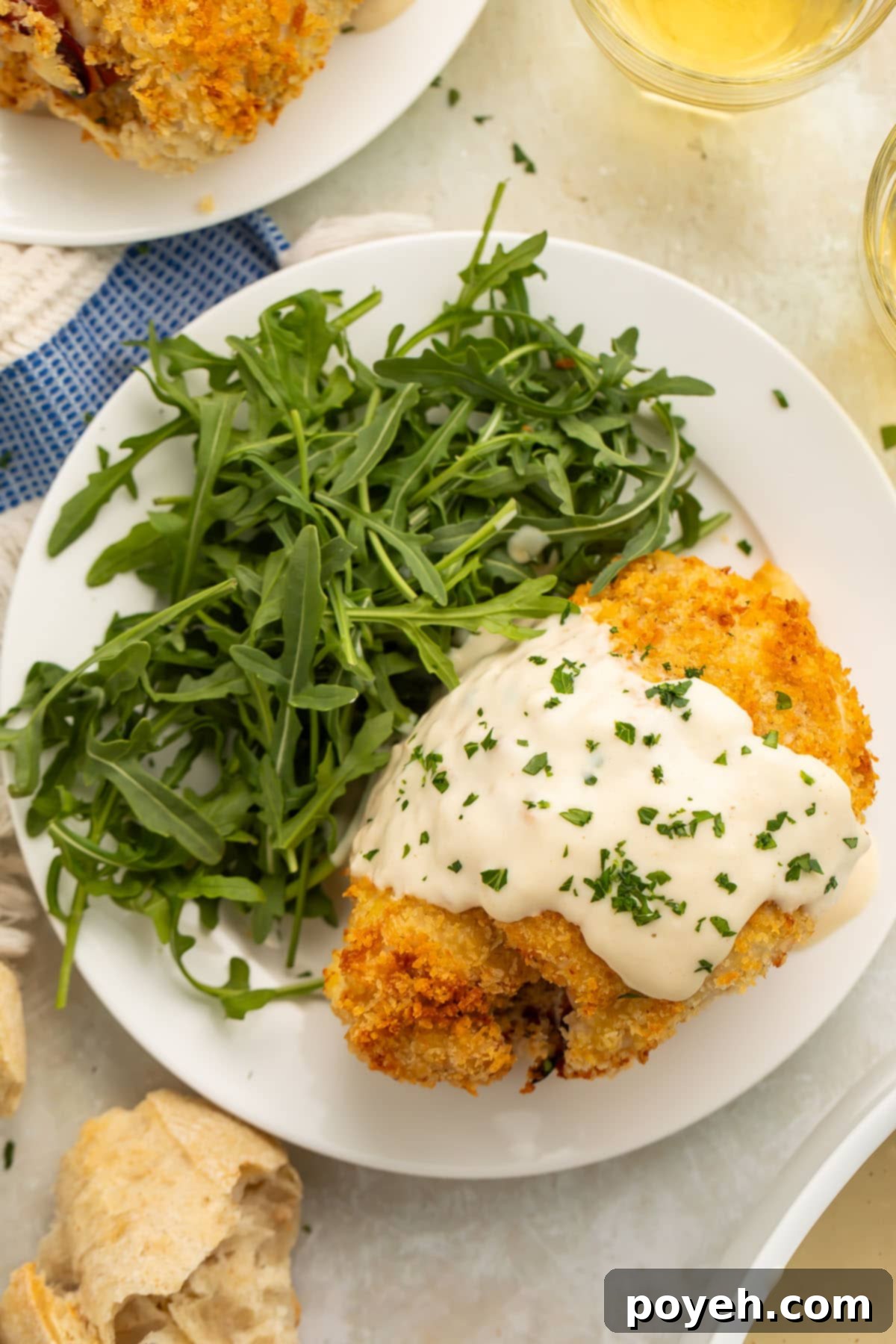 Air fryer chicken cordon bleu plated with a green salad.