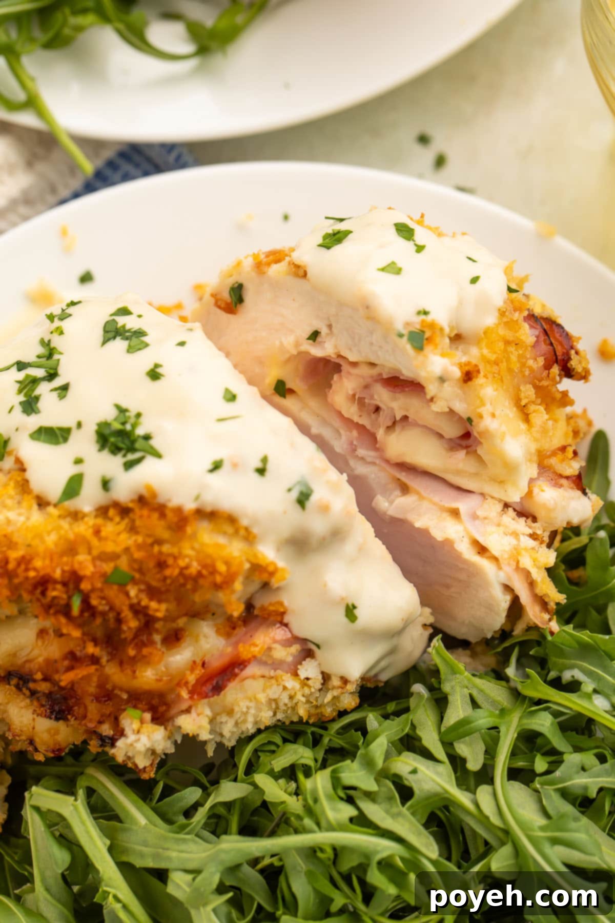Air fryer chicken cordon bleu plated with a green salad.