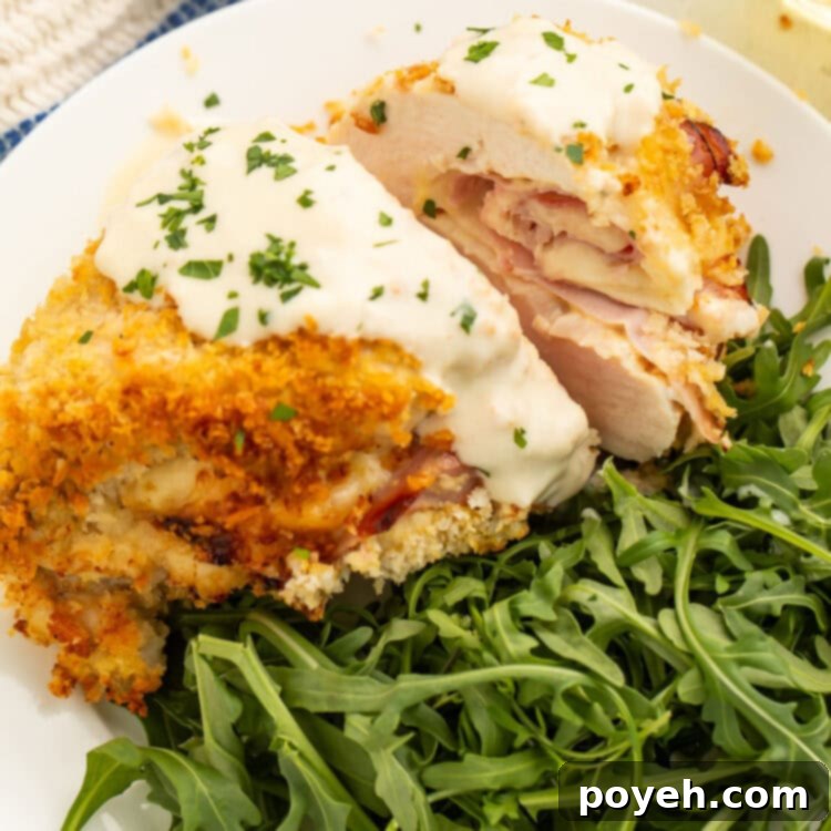 Air fryer chicken cordon bleu plated with a green salad.