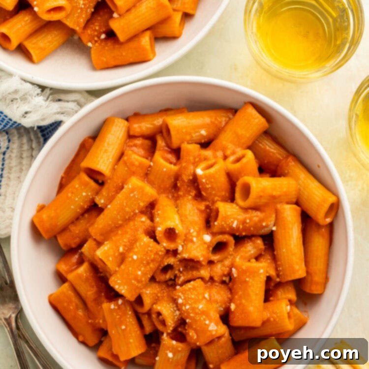 Two white bowls of rigatoni alla vodka.