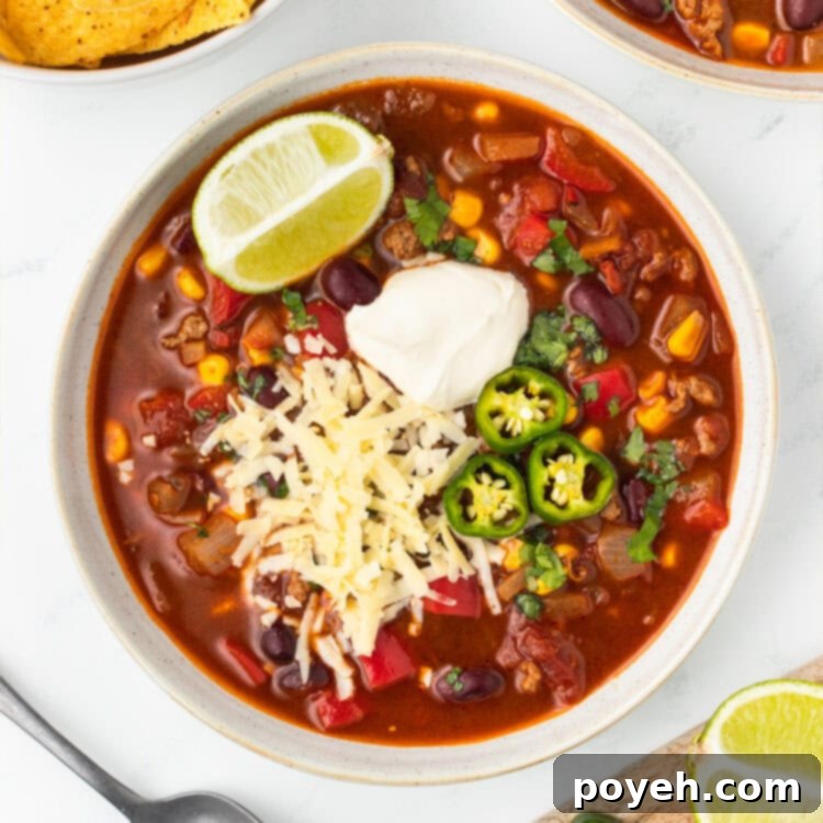 A perfectly plated bowl of Chili with Corn, expertly garnished and ready to be enjoyed.