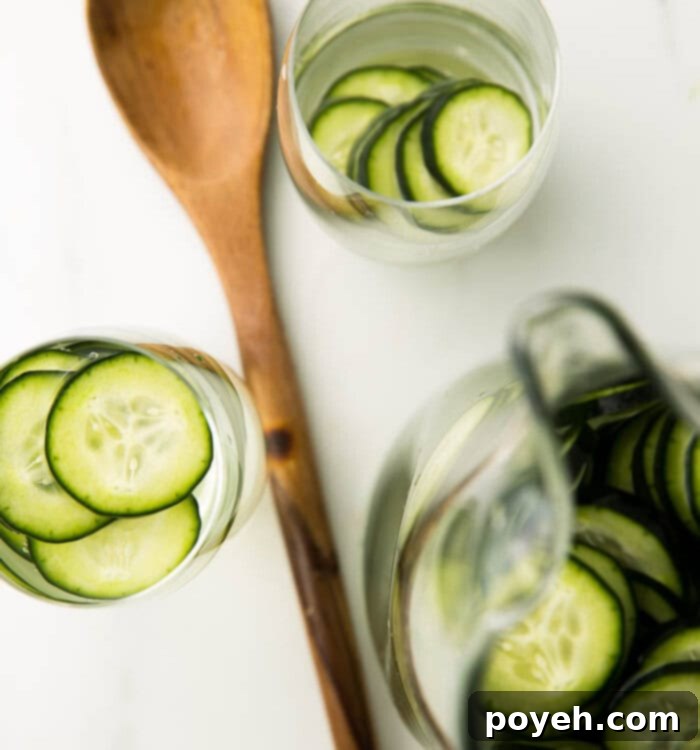 Effortless Cucumber Water for Ultimate Refreshment 5 Beautifully presented glass of cucumber water with fresh slices and ice