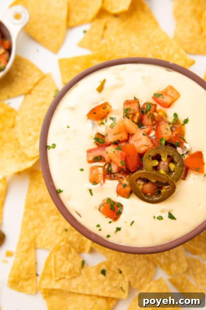 A bowl of creamy Crockpot queso dip, ready to be enjoyed