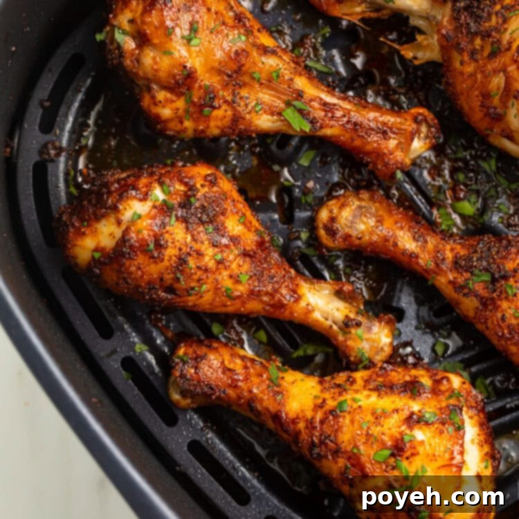 Crispy air fryer chicken legs, perfectly seasoned, served hot and ready to eat.