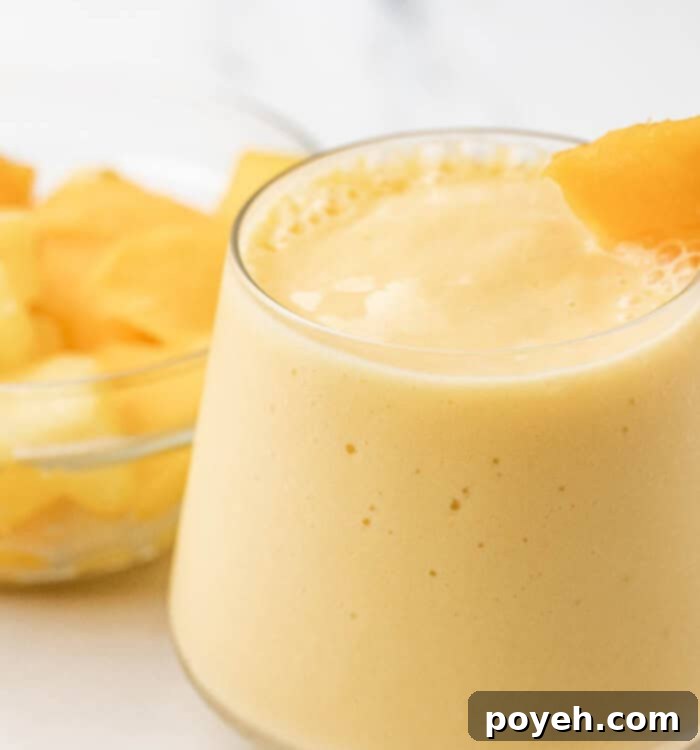 Beautifully garnished mango pineapple smoothie