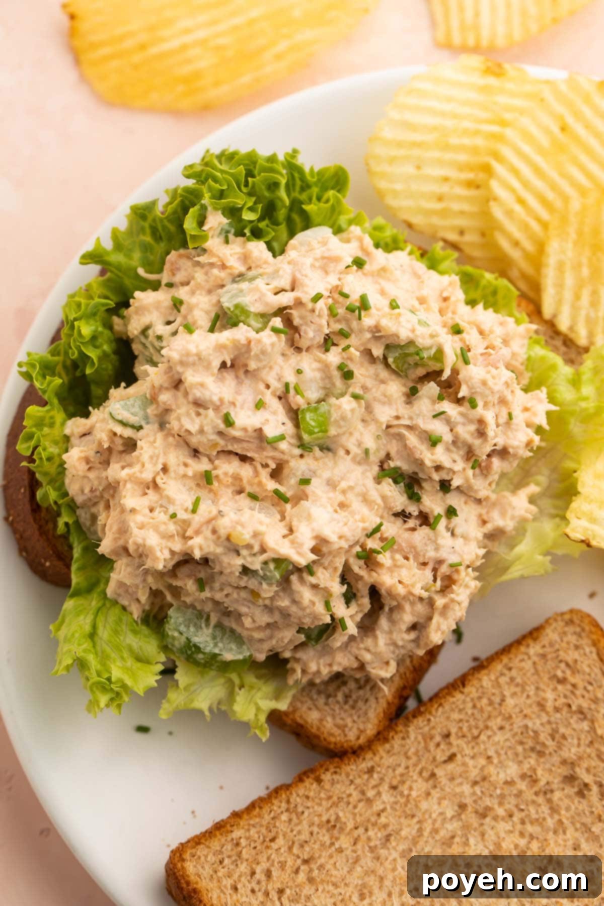 Easy tuna salad on a piece of toast with lettuce.