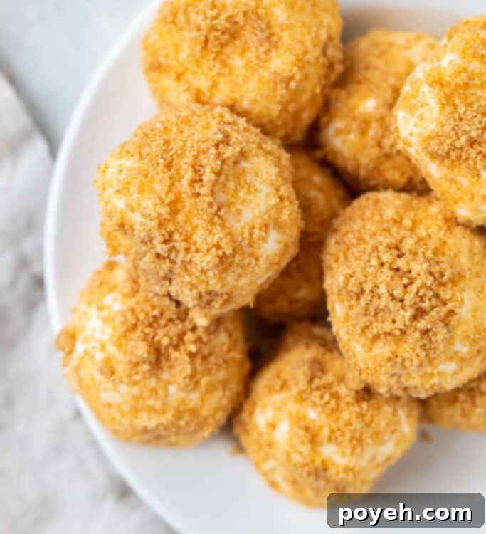 Close up of a mountain of cream cheese fat bombs on a white plate