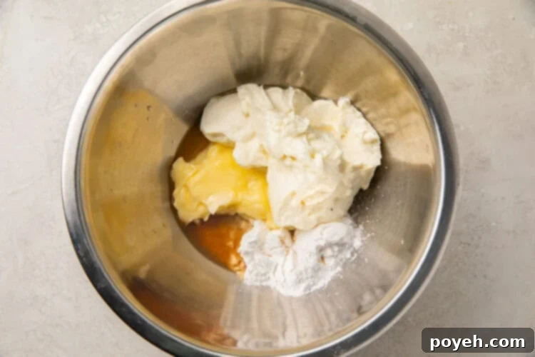 Ingredients for cream cheese fat bombs in a silver bowl