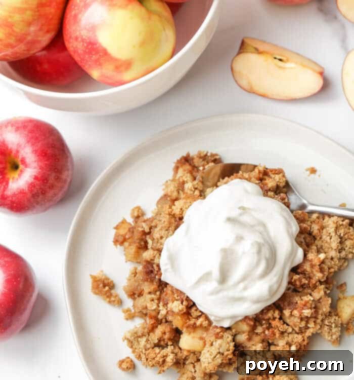 Cozy Vegan Apple Crumble 6 Vegan Apple Crisp served on a plate, close-up, showing its inviting texture.