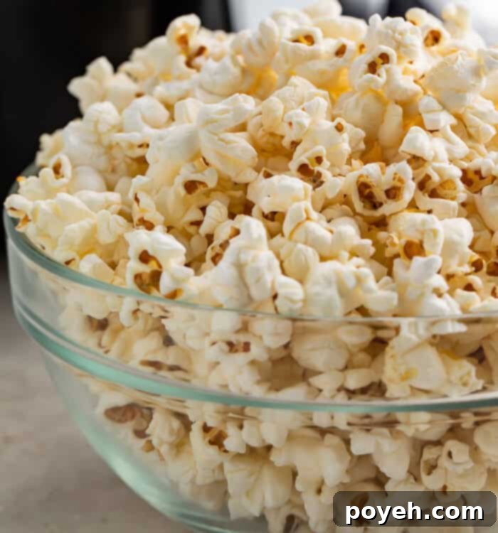 Air fryer popcorn in a glass bowl