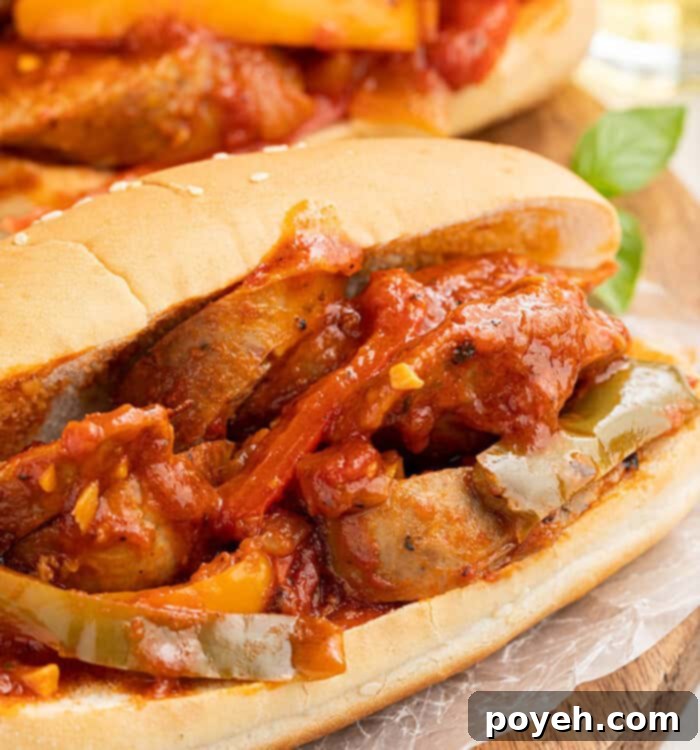 Two sandwiches filled with Instant Pot sausage and peppers