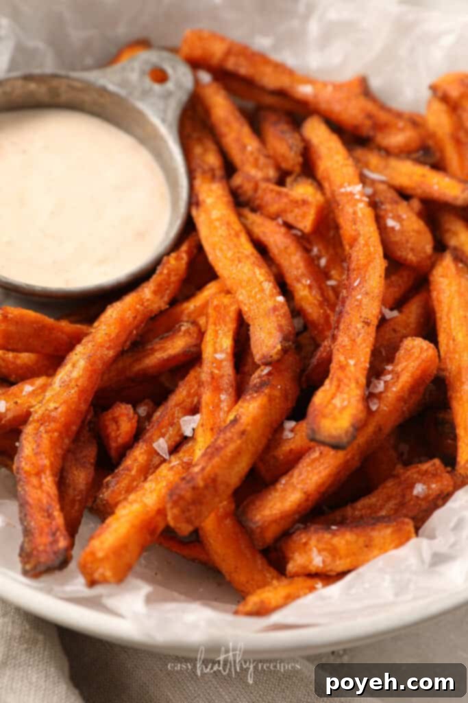 Close up of sweet potato fries in a white bowl
