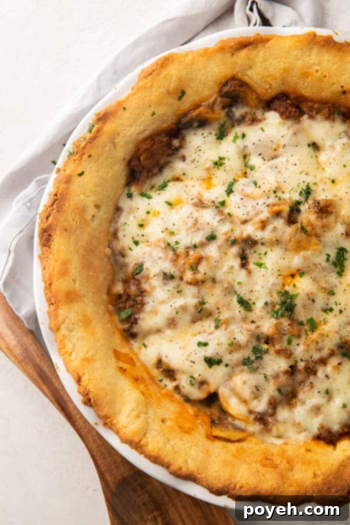 Whole ground beef, mozzarella, and mushroom keto meat pie in a keto pie crust