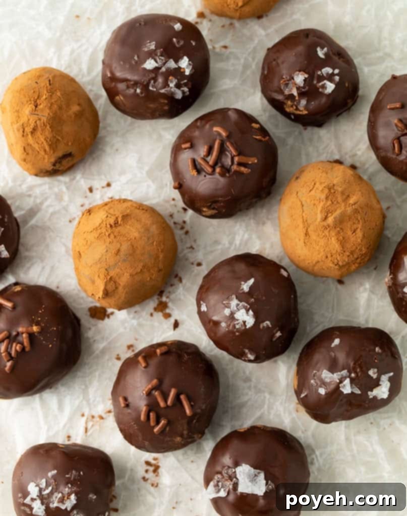 Assorted keto truffles with cocoa powder, sea salt, and chocolate sprinkles as toppings.