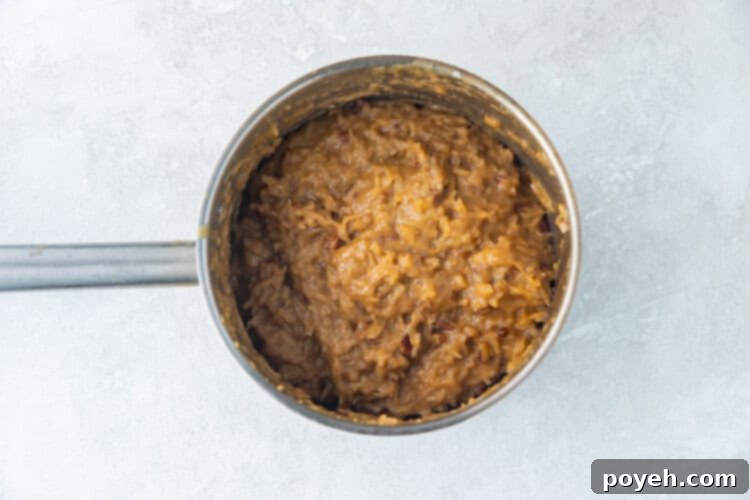 German chocolate cake frosting in a silver saucepan